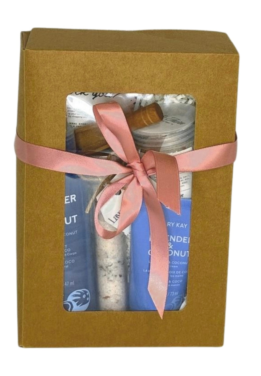 Gift set with products inside a brown box tied with a pink ribbon