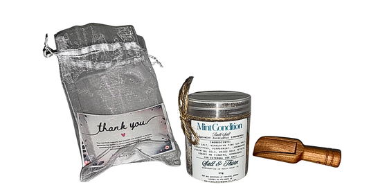 Product packaging with a drawstring bag, a tin labeled 'Mint Condition', and a wooden tool on a white background.