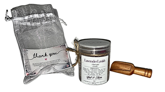 Candle with packaging and wooden tool on a white background