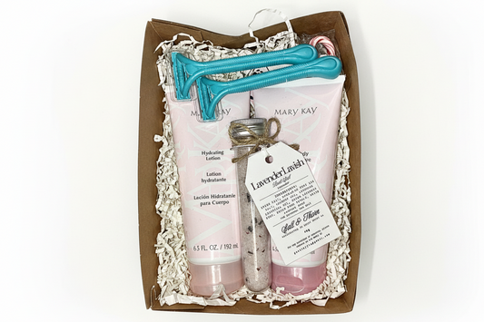 Mary Kay product set with two lotion bottles and a bath salt in a decorative box.