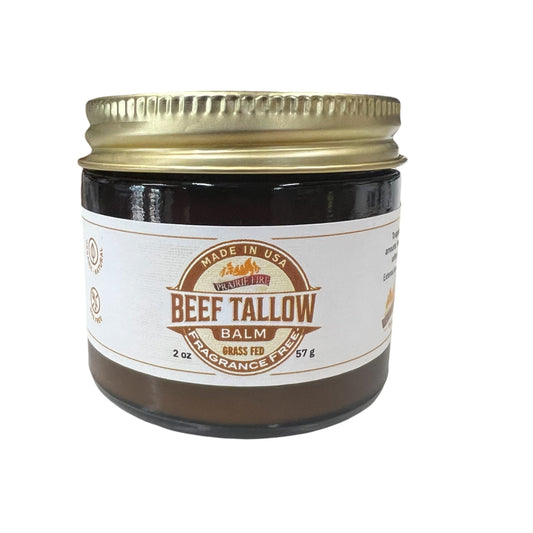 Jar of beef tallow balm with a gold lid on a white background