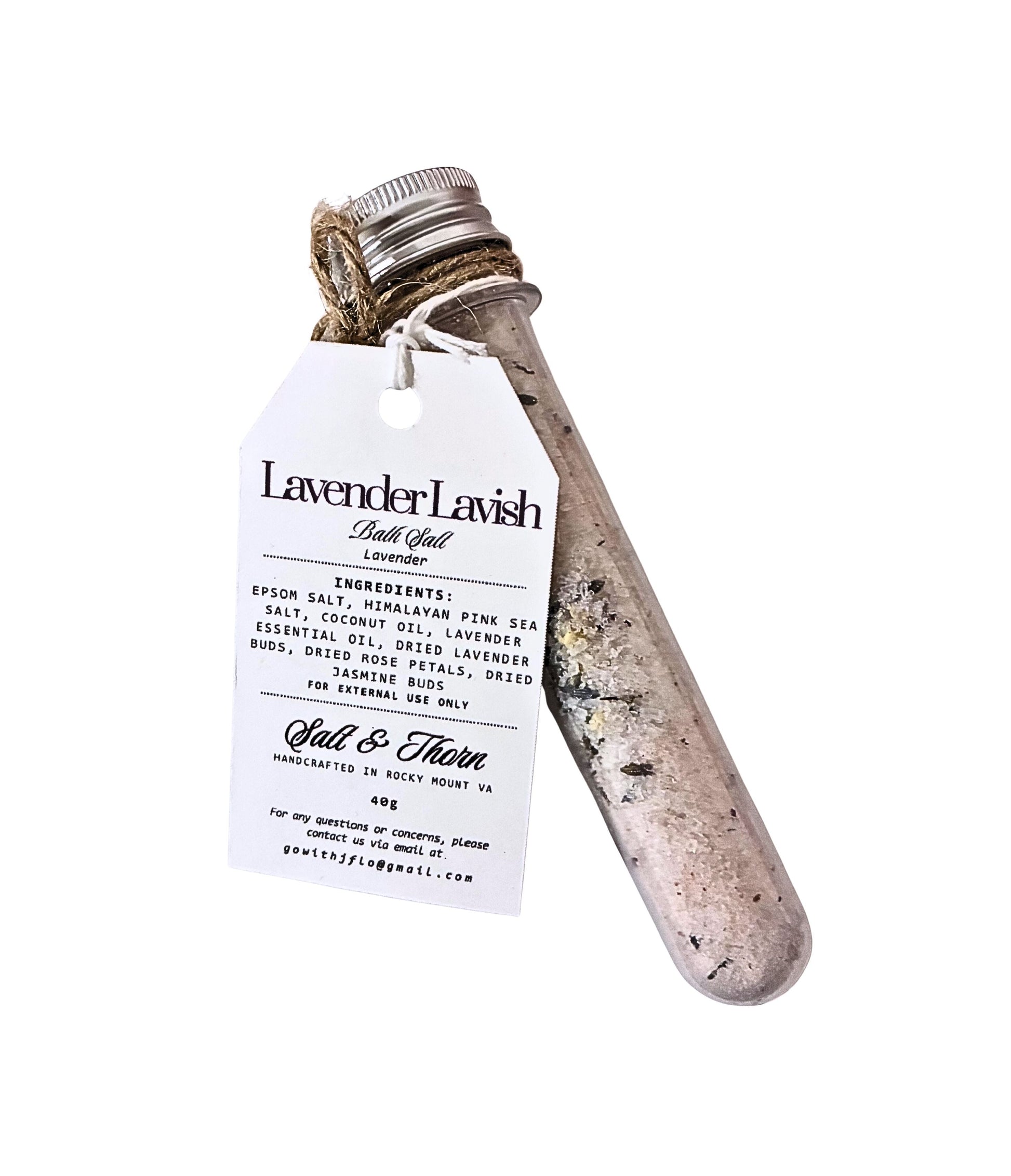 Bath salt with a wooden scoop and label on a white background