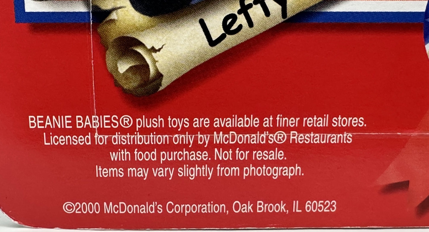 Beanie Baby packaging with text about availability and licensing, featuring a red background.