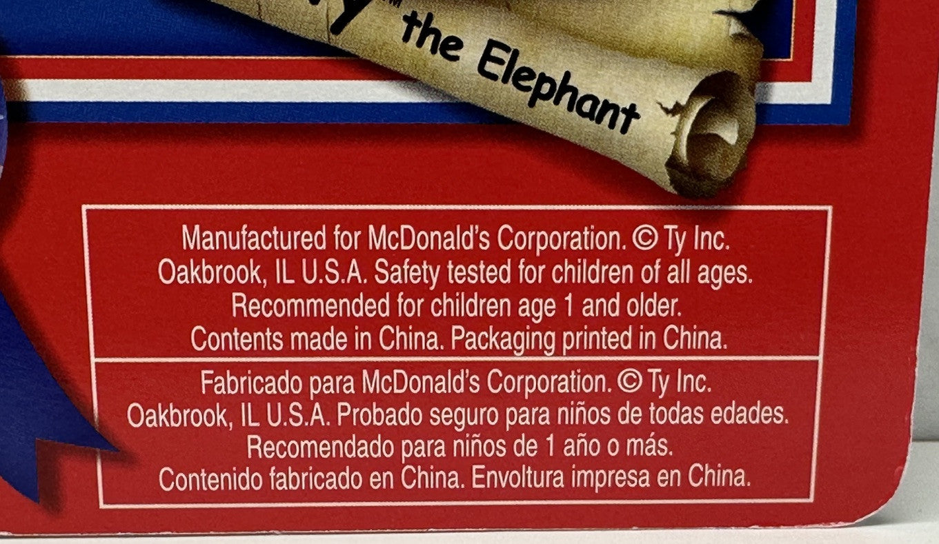 Back of a toy packaging with text about McDonald's Corporation and product details.